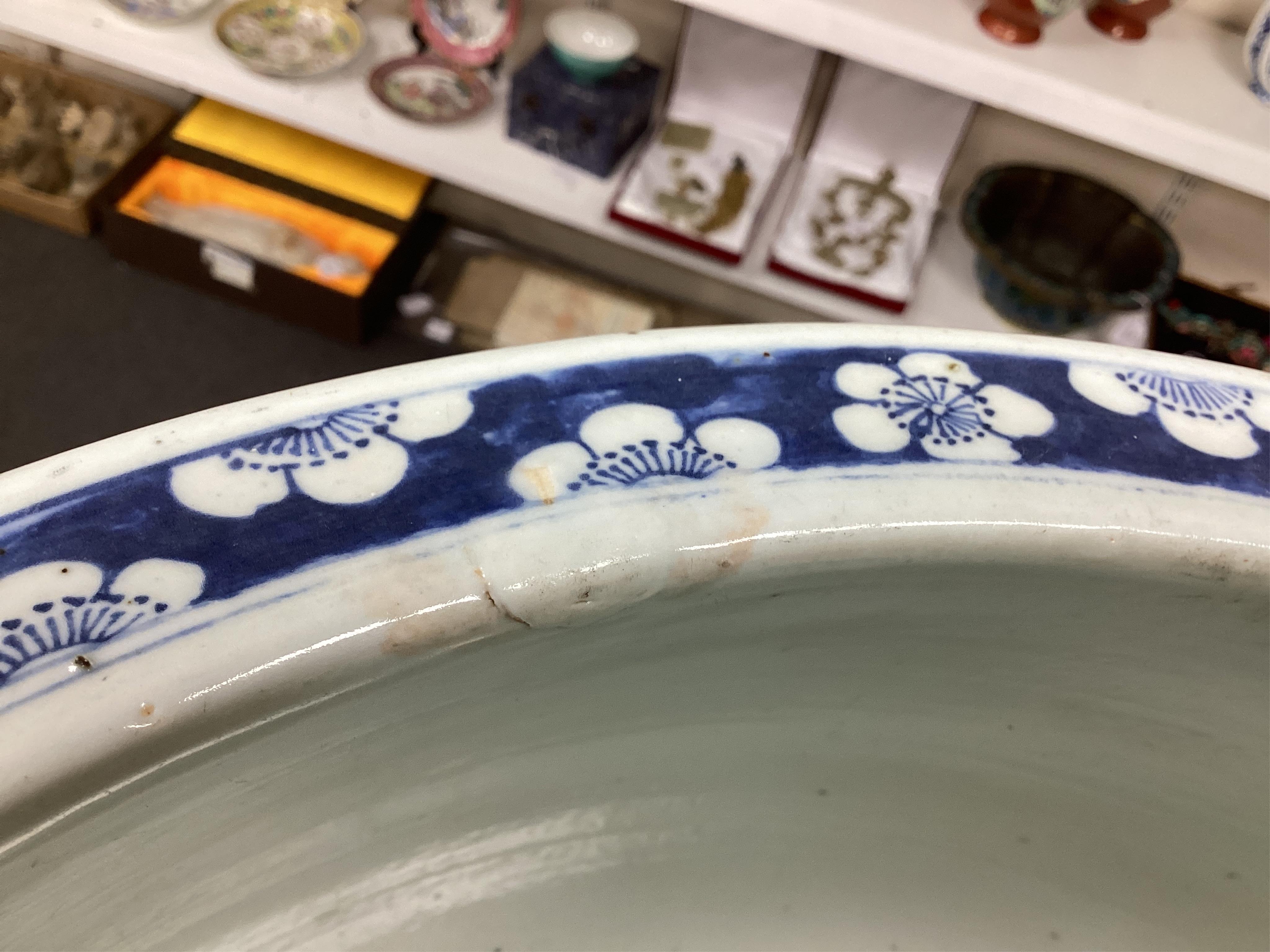 A large Chinese blue and white ‘Hundred Antiques’ jardinere and hongmu stand, late 19th/early 20th century